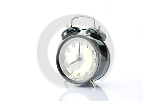 Black alarm clock isolated on white