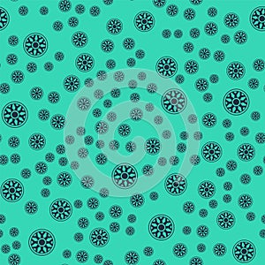 Black Alloy wheel for car icon isolated seamless pattern on green background. Vector