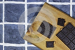 black almond chocolate bar on cutting board.