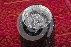 black aluminum can, with drops of water