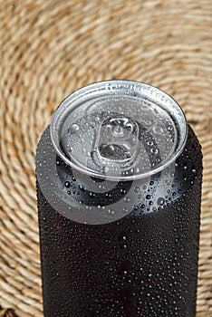 black aluminum can, with drops of water