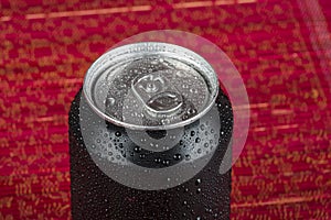 black aluminum can, with drops of water