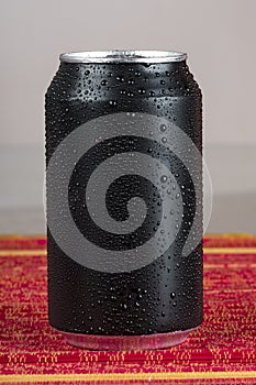 black aluminum can, with drops of water