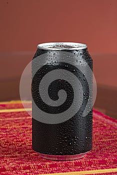 black aluminum can, with drops of water