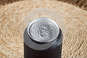 black aluminum can, with drops of water