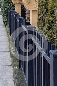 Black Aluminum Fence in city. Iron wrought fence