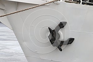 Black anchor on the white board closeup
