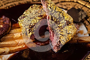 Black Angus 24 carat gold steak. Beef tenderloin, foie gras, fresh black truffle, white asparagus, port wine sauce