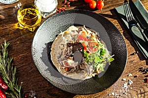Black Angus beef tagliatelle pasta with fresh black truffles and parmegano. Delicious healthy traditional food closeup