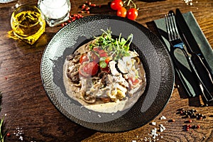 Black Angus beef tagliatelle pasta with fresh black truffles and parmegano. Delicious healthy traditional food closeup