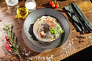Black Angus beef tagliatelle pasta with fresh black truffles and parmegano. Delicious healthy traditional food closeup