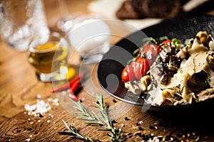 Black Angus Pasta served in a black bowl in restaurant