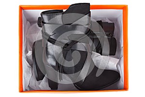 Black ankle boots in a box