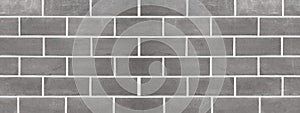 Black anthracite gray grey brick tiles tilework glazed ceramic wall or floor texture wide background banner panorama pattern