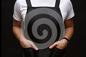 Black apron on a man closeup