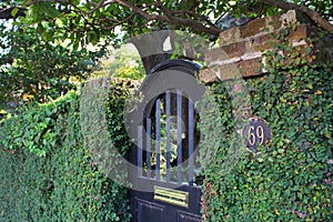 Black Arched Gate Doorway Entrance to Garden