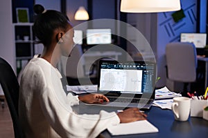 Black architect using cad softwer to build buildig plan photo