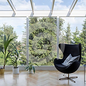 Black armchair and oriel window photo