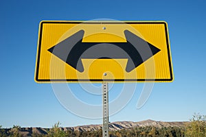 Black arrows on Yellow Road Sign