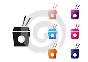 Black Asian noodles in paper box and chopsticks icon isolated on white background. Street fast food. Korean, Japanese