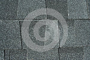 Black asphalt roofing shingles background