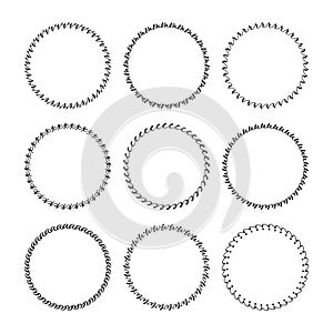 Black assorted round empty and blank emblems icons with different curvy doodle pattern borders design elements set on white