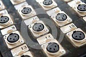 Black audio board console with plugs