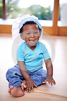 Black baby, portrait and chefs hat in house on floor for kids youth, playing and fun. African child, happy and smile in