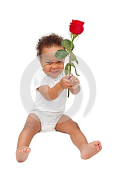 Black baby presenting flower rose.