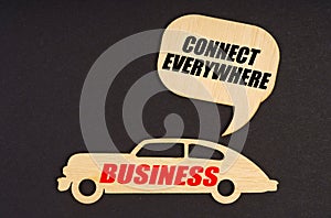 On a black background, a car with the inscription Business, above it a plate with the inscription - Connect Everywhere