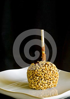 Black background caramel apple