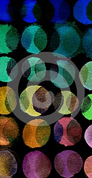 Black background of multicolored watercolor circles. Abstract composition of watercolor circles on a black background.