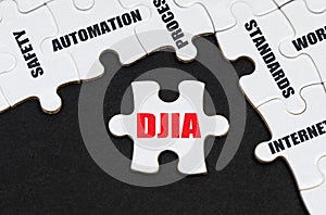 On a black background, puzzles with inscriptions, on a separate puzzle there is an inscription - DJIA