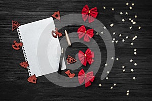Black background of Xmas. Letter for Santa Claus. Toys and red toys. Space for text. Top view