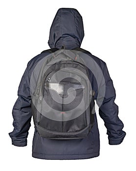 Black backpack dressed in a blue jacket isolated on a white background. rear view of a backpack and jacket