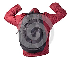 Black backpack dressed in a red jacket isolated on a white background
