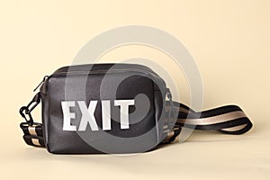 Black bag captioned 'EXIT'