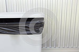 Black bag plastic in white trashcan