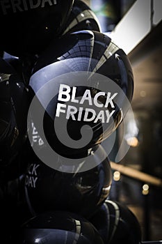 Black balloons with Black Friday logo.