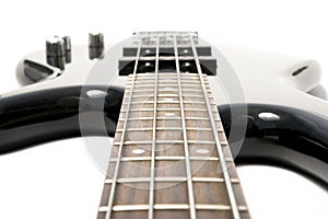 Black bass guitar with strained strings photo