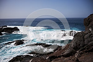 Black bay with blue ocean in Tenerife, black voulcanic sand