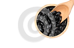 Black bean in wooden bowl isolated on white background