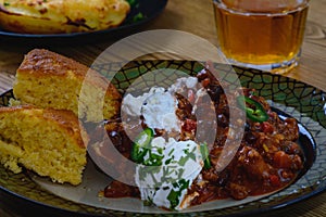 Black Bean Chili Con Carne in Bowl with Corn Bread