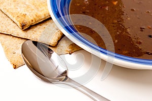 Black Bean Soup with Pita Bread, with spoon.