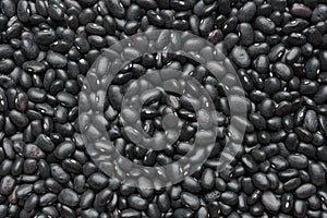 Black beans background. Texture of black bean grains