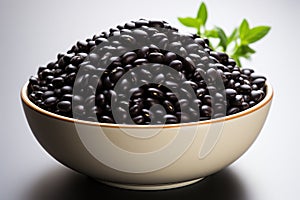 Black beans in a bowl on a white background. Selective focus. Generative AI