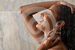 Black beautiful girl relaxing in the shower