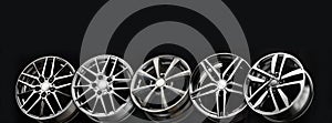 black beautiful sports alloy wheels forged stand in a row