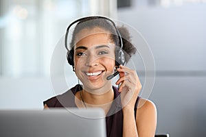 Black beautiful woman smiling during business phone call