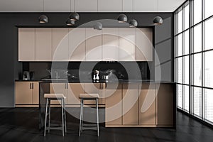Black and beige kitchen with breakfast bar